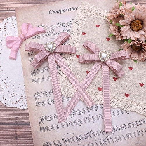 "Achetez des barrettes pour cheveux en forme de cœur avec strass chez AOMshop" Beige pink pair