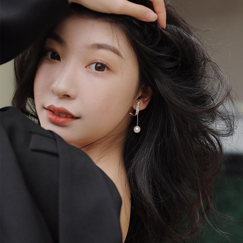 Boucles d'oreilles géométriques avec perles