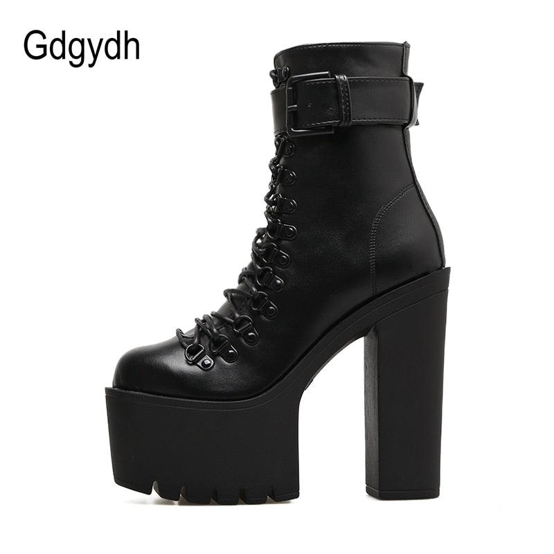 "Chaussures moto femme : bottines en cuir avec talons hauts et boucles métalliques"