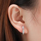 Boucles d'oreilles pour femmes classiques à anneaux torsadés avec zircons cubiques